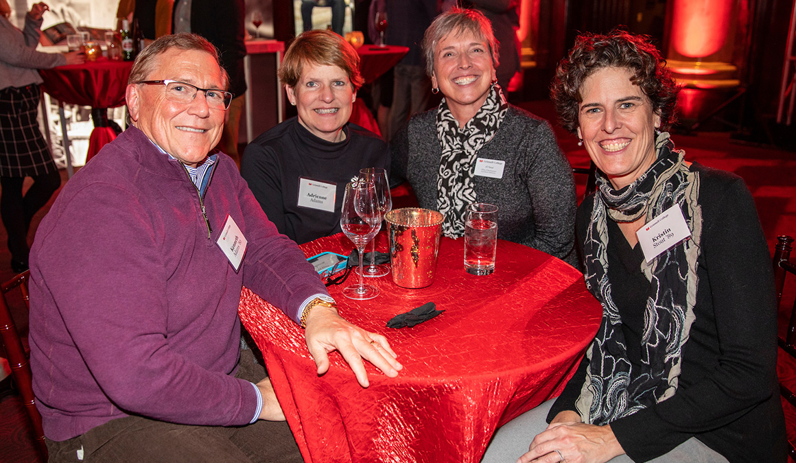 Kristin Stout '89, right, shares drinks and conversation with Kenneth Adams '80, Adrienne Adams, and Jill Petsel at the Des Moines campaign kickoff.